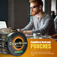 Man working at a desk with CogniBlaze nootropic pouches displayed.